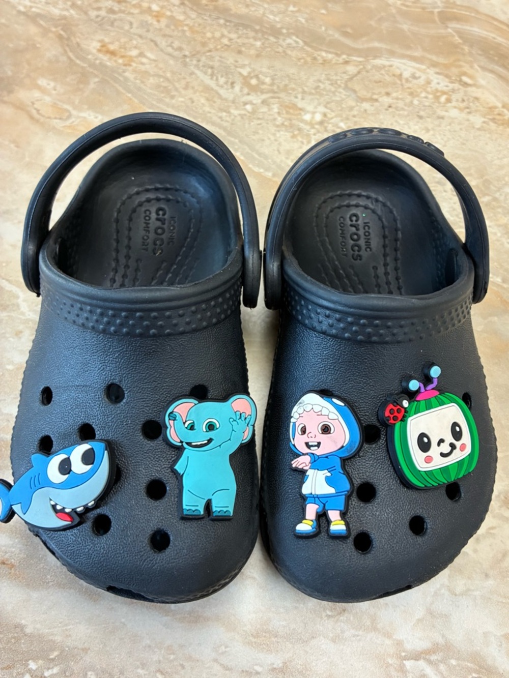 Toddler size 6 CROCS clogs black with Cocomelon charms